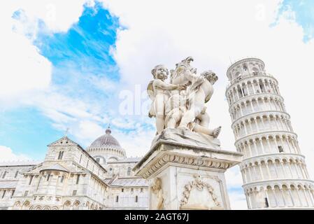 Cherub Statue, Leaning Tower of Pisa, and Pisa Cathedral on Sunny Day Stock Photo