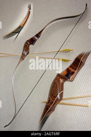 Traditional laminated recurve bow with riser and close up details. Stock Photo