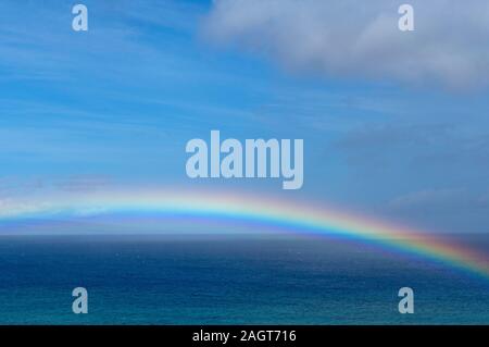 Rainbow over the Pacific from Kahana, Maui, Hawaii Stock Photo