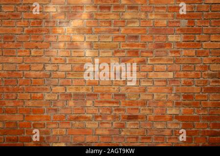 part of the wall built with plain orange color bricks suitable for wallpaper Stock Photo