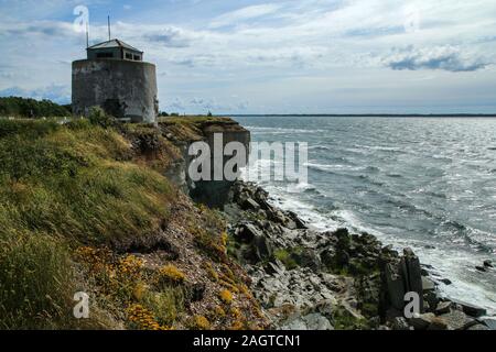 The Picture from the wild coast of Paldiski in Estonia. You can see the old military building from soviet era standing on the cliff. Stock Photo