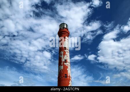 The Picture from the wild coast of Paldiski in Estonia. You can see the old lighthouse standing on the shore, used for navigation in past times. Stock Photo