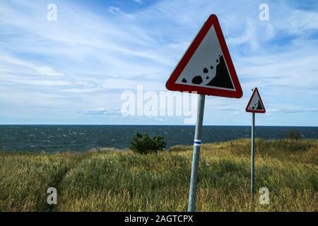 The Picture from the wild coast of Paldiski in Estonia. You can see the warning signs showing the instability of the cliffs. Stock Photo