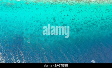Turquoise sea water for background. Transparent turquoise sea water, natural background. Summer and travel vacation concept. Stock Photo