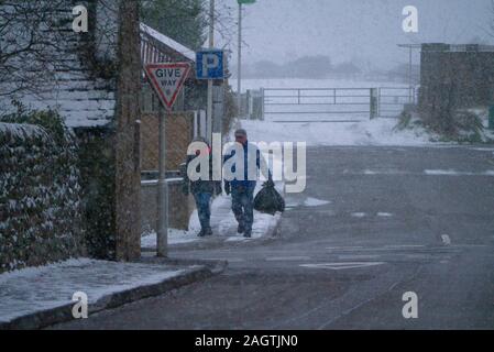 A couple brave heavy snow in Dornoch Sutherland Scotland UK Stock Photo