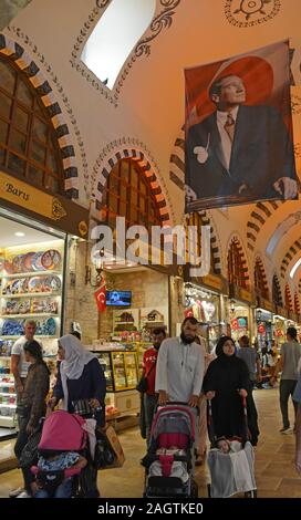 Istanbul, Turkey - September 6th 2019. Tourists walk past shops selling souvenirs in the historic Egyptian Spice Bazaar in Eminonu, Fatih, Istanbul, a Stock Photo