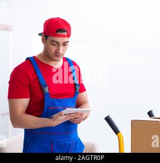 The contractor worker moving boxes during office move Stock Photo