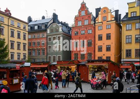 Sweden, Stockholm, December 18, 2019: Christmas atmosphere of the city. Locals and city guests in the Christmas market in Stockholm Old Town. Sale of Stock Photo