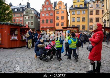 Sweden, Stockholm, December 18, 2019: Christmas atmosphere of the city. School children and city guests in the Christmas market in Stockholm Old Town. Stock Photo