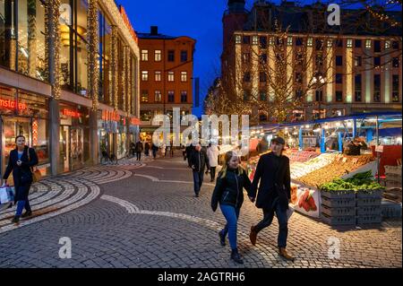 Sweden, Stockholm, December 18, 2019: Christmas atmosphere of the city. Market stalls with flowers, fruit, vegetables and souvenirs at the Hotorget sq Stock Photo