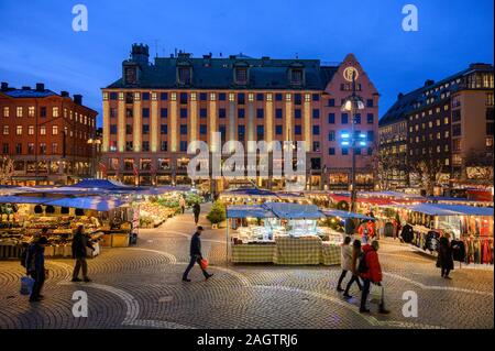 Sweden, Stockholm, December 18, 2019: Christmas atmosphere of the city. Market stalls with flowers, fruit, vegetables and souvenirs at the Hotorget sq Stock Photo