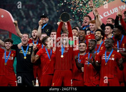 Liverpool's Jordan Henderson celebrates with the trophy after the FIFA Club World Cup final at the Khalifa International Stadium, Doha. Stock Photo