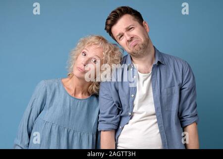 Mother and son having life problems, distressed down young man and woman lost i Stock Photo