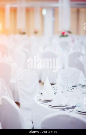 Wedding table in white decoration cloth in wedding venue Stock Photo