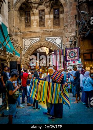 November 2019, LUXOR, EGYPT - Moslem man sells rug at Luxor Souq, Egypt Stock Photo