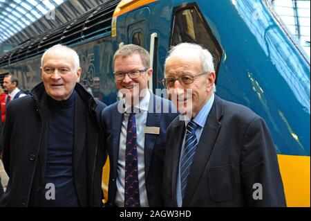 King's Cross Station, London, UK. 21st December 2019. London North Eastern Railway Company restored an InterCity 125 set to its original British Rail livery for a special four-day tour around the LNER network as the trains end 40 years of service on the East Coast Main Line. Sir Kenneth Grange the loco designer poses with LNER MD David Horne and David Russell, BR engineer who introduced HST's to the East Coast Main Line. G.P. Essex/Alamy Live News Stock Photo