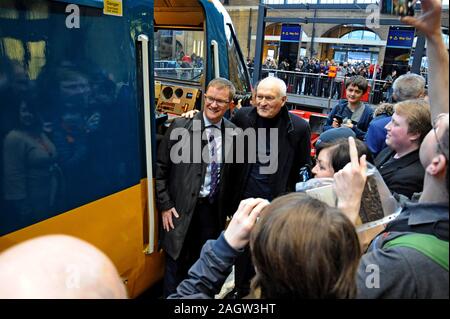 King's Cross Station, London, UK. 21st December 2019. London North Eastern Railway Company restored an InterCity 125 set to its original British Rail livery for a special four-day tour around the LNER network as the trains end 40 years of service on the East Coast Main Line. Sir Kenneth Grange the loco designer poses for enthusists photos with LNER MD David Horne  G.P. Essex/Alamy Live News Stock Photo