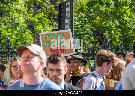 LONDON - SEPTEMBER 20, 2019: Climate Change placard held above Extinction Rebellion protesters Stock Photo