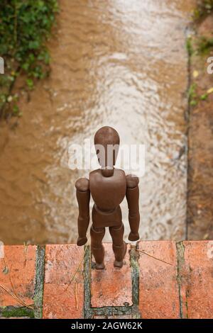 A mannequin depicts a person who is in deep depression and contemplating giving up their life, by suicide. Stock Photo