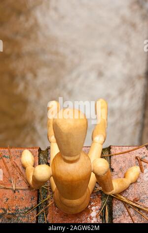 A mannequin depicts a person who is in deep depression and contemplating giving up their life, by suicide. Stock Photo