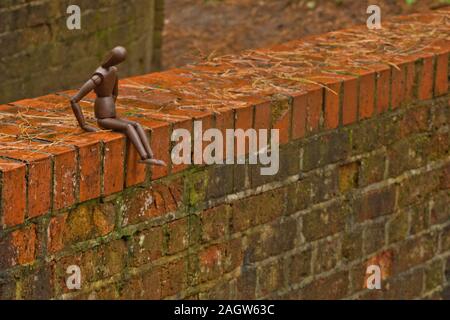 A mannequin depicts a person who is in deep depression and contemplating giving up their life, by suicide. Stock Photo