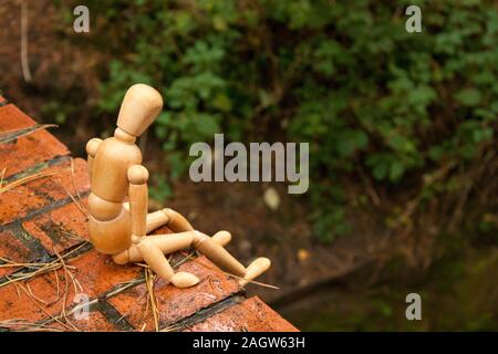 A mannequin depicts a person who is in deep depression and contemplating giving up their life, by suicide. Stock Photo