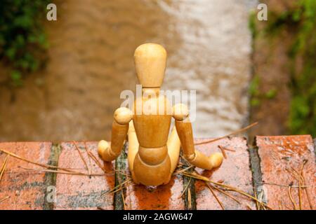 A mannequin depicts a person who is in deep depression and contemplating giving up their life, by suicide. Stock Photo