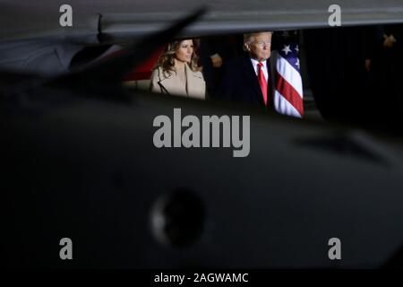 United States President Donald J. Trump, accompanied by first lady Melania Trump, arrives to make remarks and sign S.1790, the National Defense Authorization Act for Fiscal Year 2020 at Joint Base Andrews in Suitland, Maryland on Friday, December 20, 2019.Credit: Yuri Gripas/Pool via CNP /MediaPunch Stock Photo