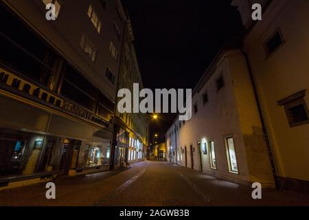 BRNO, CZECHIA - NOVEMBER 5, 2019: Medieval empty and deserted pedestrian narrow street of Brno, Josefska Ulice, at night, surrounded by closed shops a Stock Photo