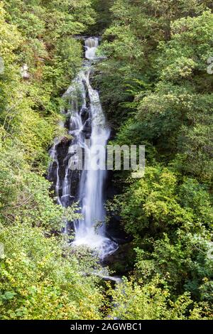 The Black Spout is a sixty meter waterfall in the woods near Pitlochry scene here surrounded by healthy green trees late in the summer Stock Photo