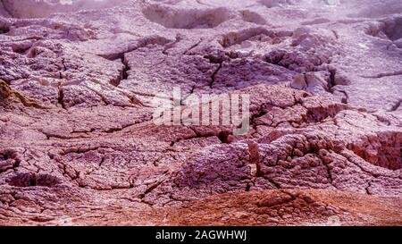 Dried Cracked Mud in Fountain Paint Pot Geyser in Yellowstone National Park, Wyoming, United States Stock Photo