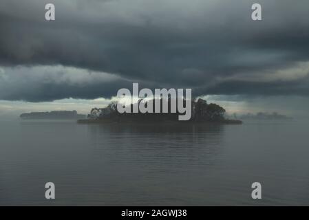 Lake in the fog, before the rain. Late fall Stock Photo