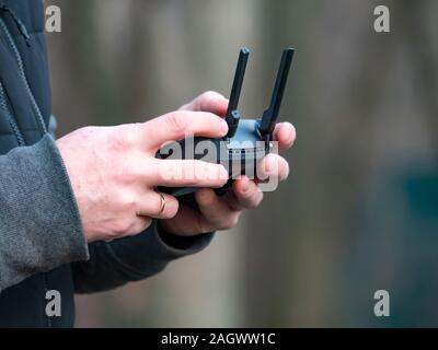The quadrocopter control panel in the hands of a man. Dron.Technology. Place for text. Background image. Stock Photo