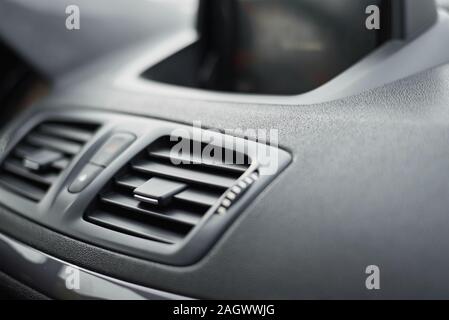 air conditioner ventilation grille in car. Climate control panel Stock Photo