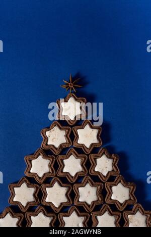 2020 New Year Alternative Christmas trees homemade cookies Christmas-tree decorations-balls lying on a blue background. Close-up, horizontal layout, Stock Photo