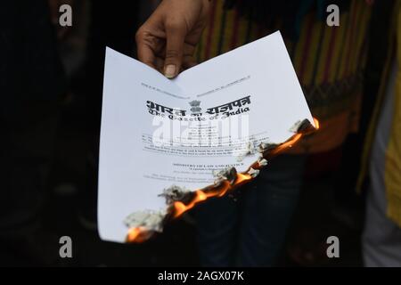 Kolkata, India. 19th Dec, 2019. Burning of Citizenship Amendment Act (CAA) and National Register of Citizens (NRC) copies by protesters against National Register of Citizens (NRC) and a new Citizenship Amendment Act (CAA). Kolkata, West Bengal, India. 19th December 2019. (Photo by Sukhomoy Sen/Pacific Press) Credit: Pacific Press Agency/Alamy Live News Stock Photo
