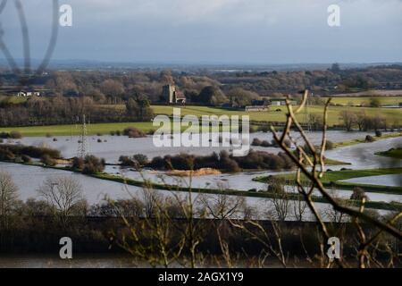 Lewes UK 22nd December 2019 - Flooded fields and farmland at Lewes in East Sussex after overnight rain as more weather and flood warnings have been issued across Britain after days of continual rain : Credit Simon Dack / Alamy Live News Stock Photo