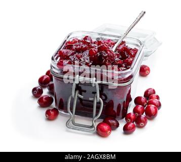 Fresh  homemade cranberry sauce in glass jar isolated on white Stock Photo