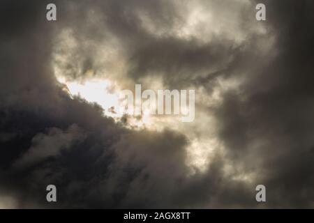 background of dark clouds covering sun Stock Photo