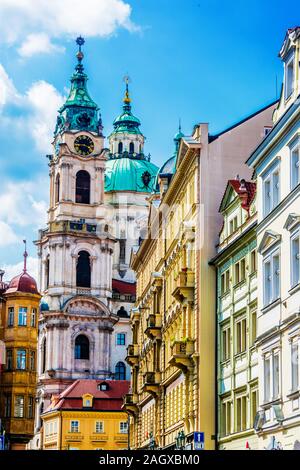 Historic architecture of downtown Prague, Czech Republic. Mostecka Street with St Nicholas Bell Tower. Stock Photo