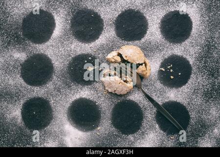 Homemade Christmas mince pie and icing sugar pattern on a slate background Stock Photo