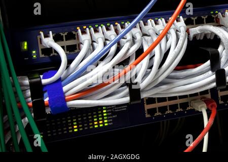 White network cables and servers in a technology data center Stock Photo