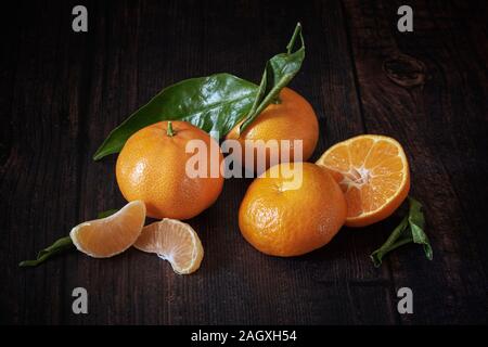 Clementine's on wooden table Stock Photo