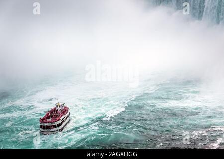 Niagara Falls - OCTOBER 06, 2018: The Maid of the Mist boat near waterfall at Niagara falls, Canada. Stock Photo