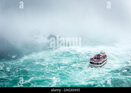 Niagara Falls - OCTOBER 06, 2018: The Maid of the Mist boat near waterfall at Niagara falls, Canada. Stock Photo