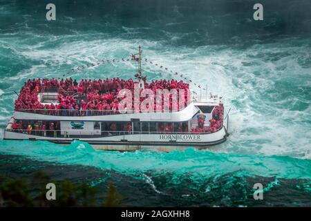 Niagara Falls - OCTOBER 06, 2018: The Maid of the Mist boat near waterfall at Niagara falls, Canada. Stock Photo