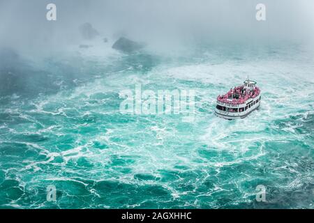 Niagara Falls - OCTOBER 06, 2018: The Maid of the Mist boat near waterfall at Niagara falls, Canada. Stock Photo