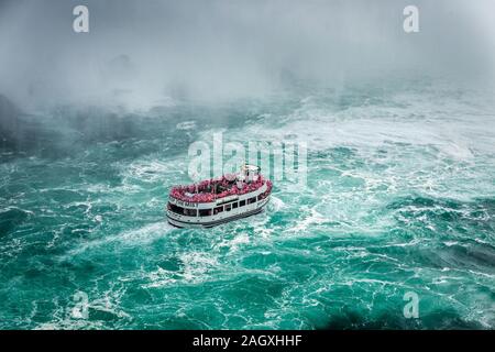 Niagara Falls - OCTOBER 06, 2018: The Maid of the Mist boat near waterfall at Niagara falls, Canada. Stock Photo