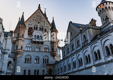 MUNICH GERMANY - December 29, 2016: The famous Neuschwanstein castle during sunset, the popular tourist attraction in the Bavarian Alps, Germany. Stock Photo