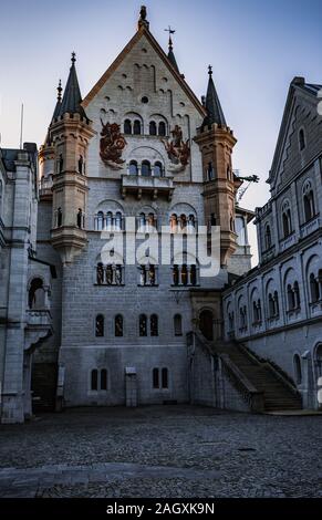 MUNICH GERMANY - December 29, 2016: The famous Neuschwanstein castle during sunset, the popular tourist attraction in the Bavarian Alps, Germany. Stock Photo